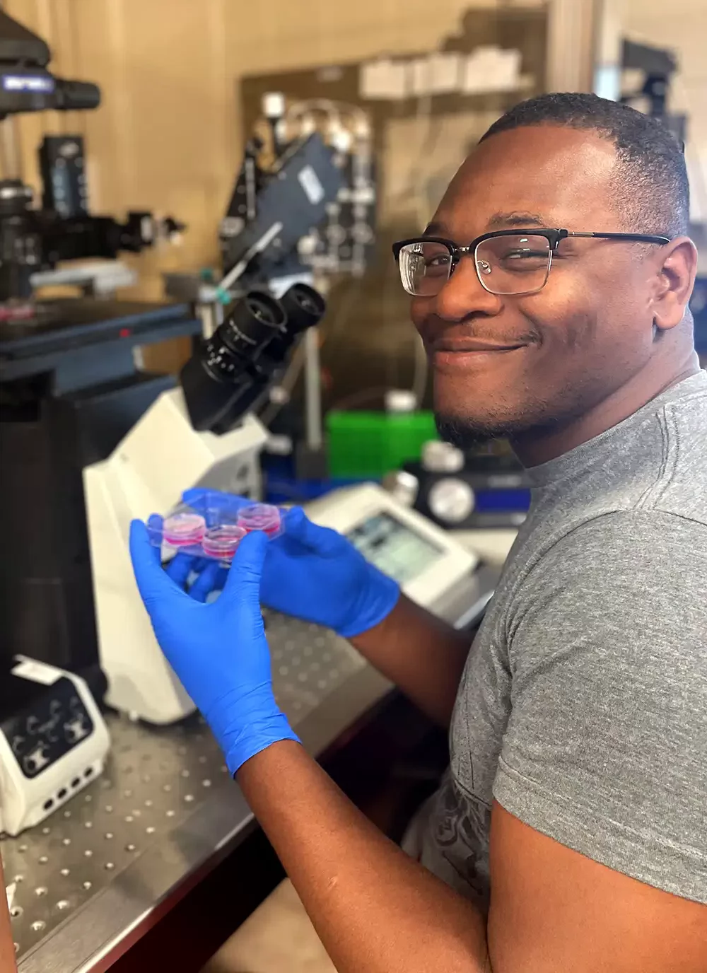 student examining microscopic materials